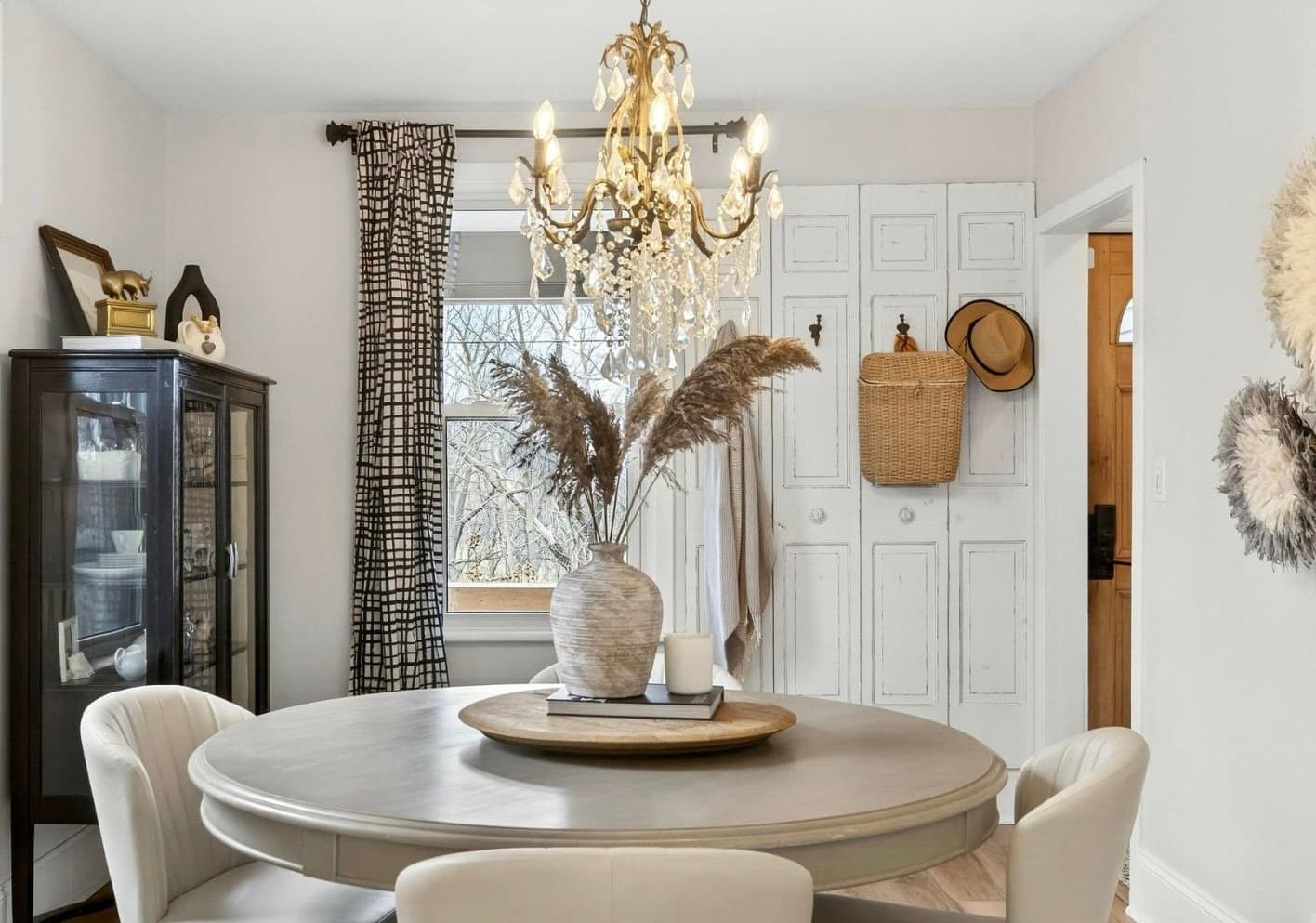 Staged dining room with chandelier